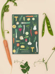 Notesbog med grøntsager og linjerede sider fra ViSSEVASSE